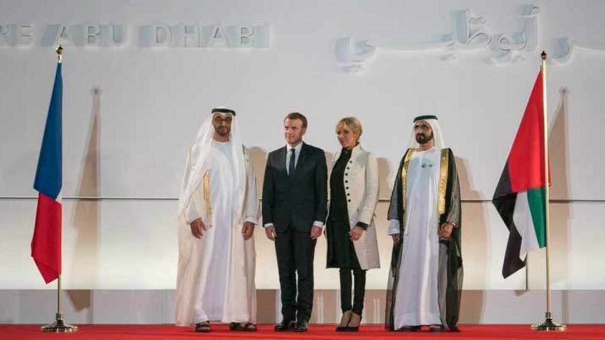 Sheikh Mohmed bin Zayed Al Nahyan, Emmanuel Macron, Brigitte Macron and Sheikh Mohammed bin Rashid Al Maktoum at the entrance of the Louvre Abu Dhabi.- Dubai Media Office/Twitter