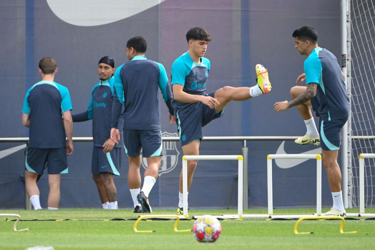 Barcelona players during a training session on Monday. — AFP