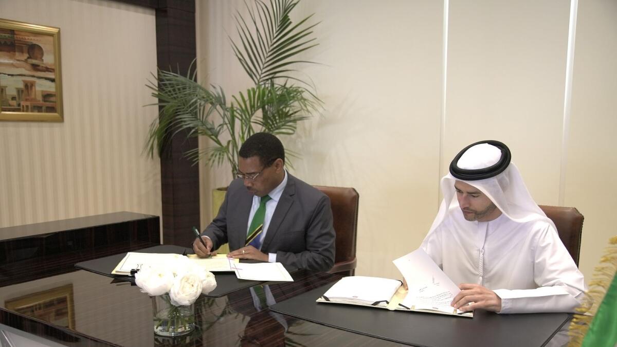 Mohamed bin Hadi Al Hussaini, Minister of State for Financial Affairs, and Dr Mwigulu Lameck Nchemba, Minister of Finance and Planning of the Republic of Tanzania, signing the agreement. —  Supplied photo