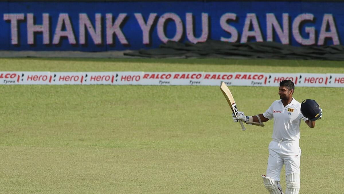 Sri Lanka’s Kumar Sangakkara walks back for one final time in his Test career after being dismissed on the fourth day of the second Test against India in Colombo.