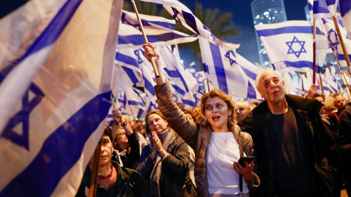 People take part in a demonstration against Israeli Prime Minister Benjamin Netanyahu and his nationalist coalition government's judicial overhaul in Tel Aviv on Saturday. — Reuters