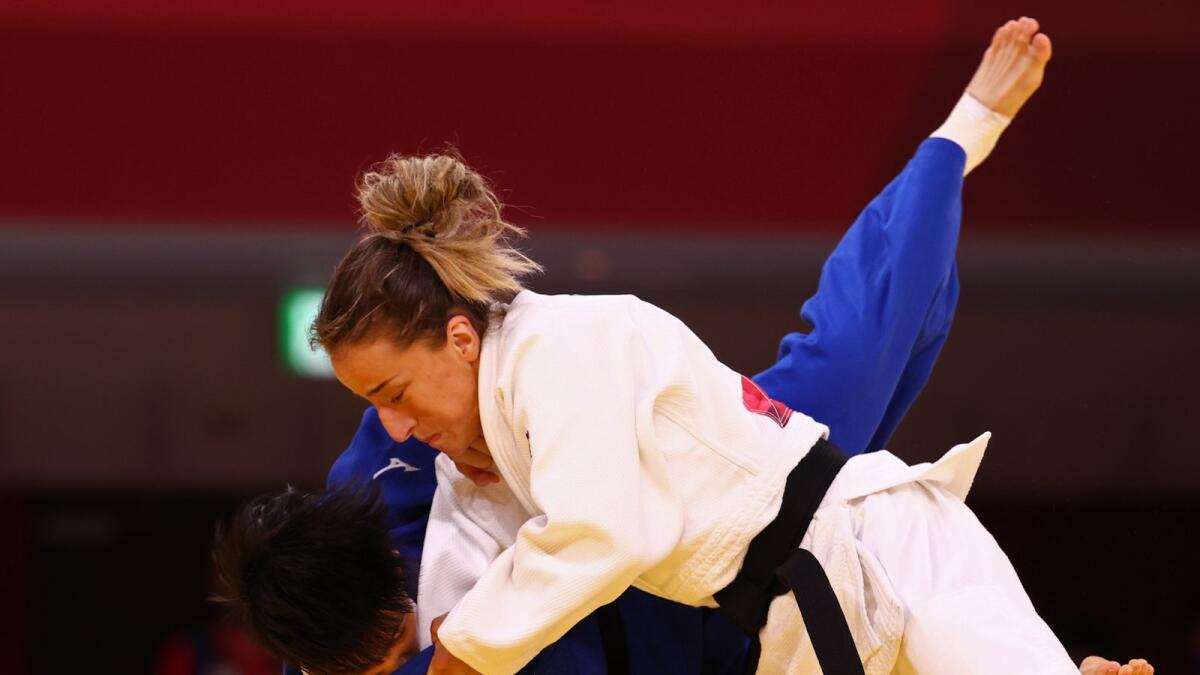 Distria Krasniqi of Kosovo in action against Lin Chen-hao of Taiwan. — Reuters