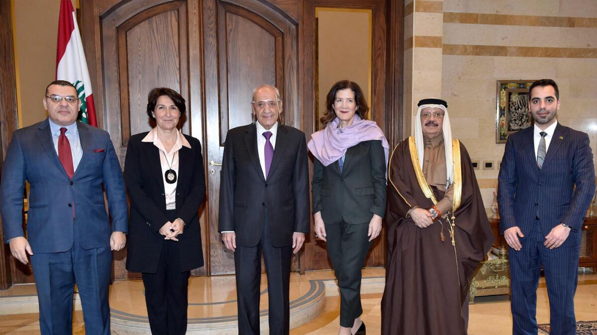 Lebanese Parliament Speaker Nabih Berri (3rd-L) posing for a group photo with ambassadors and representatives of Egypt (L), France (2nd-L), the United States (3rd-R), Saudi Arabia, and Qatar at the parliament headquarters in the capital Beirut on Monday. — AFP