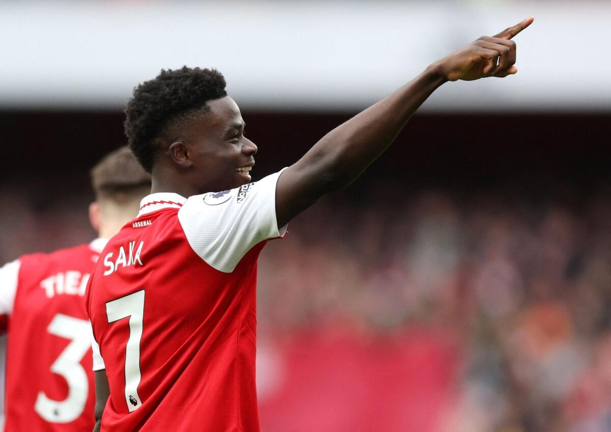 Arsenal's Bukayo Saka celebrates after scoring his second goal. — Reuters