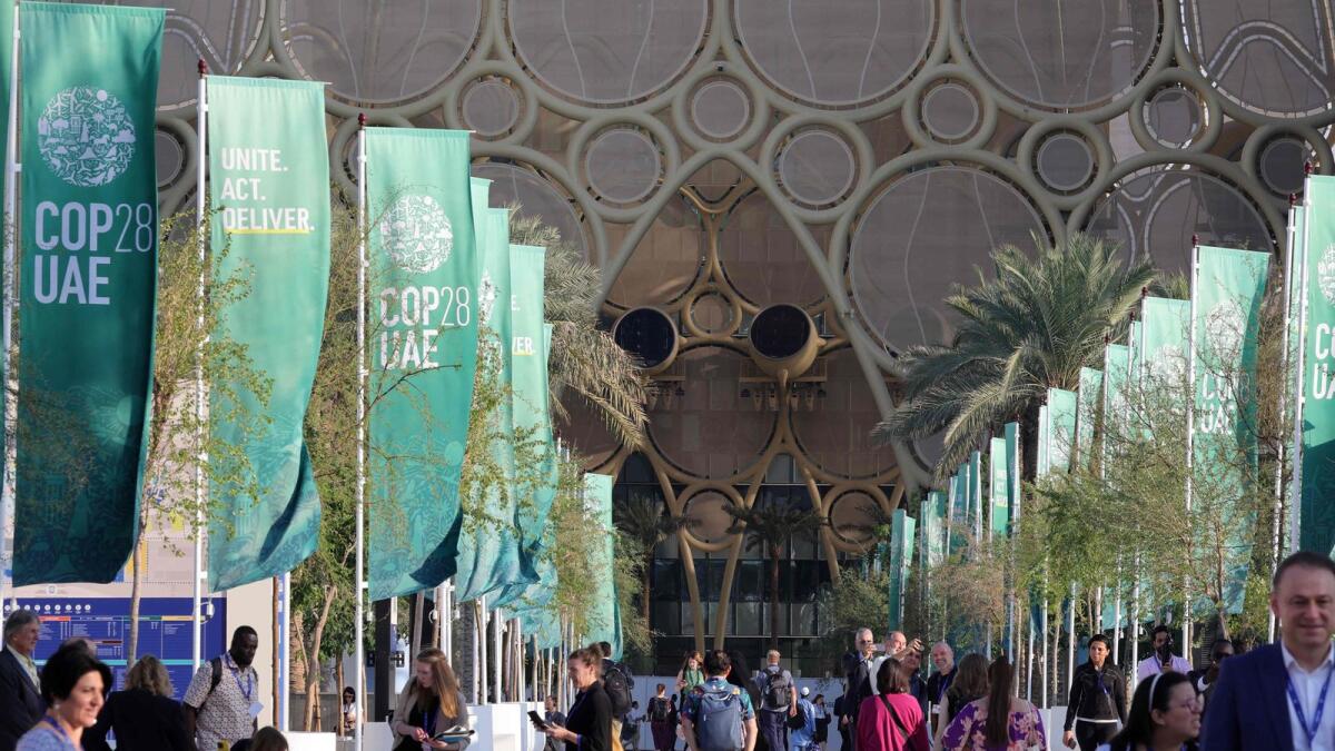 People visit the venue housing the United Nations climate summit in Dubai. — AFP