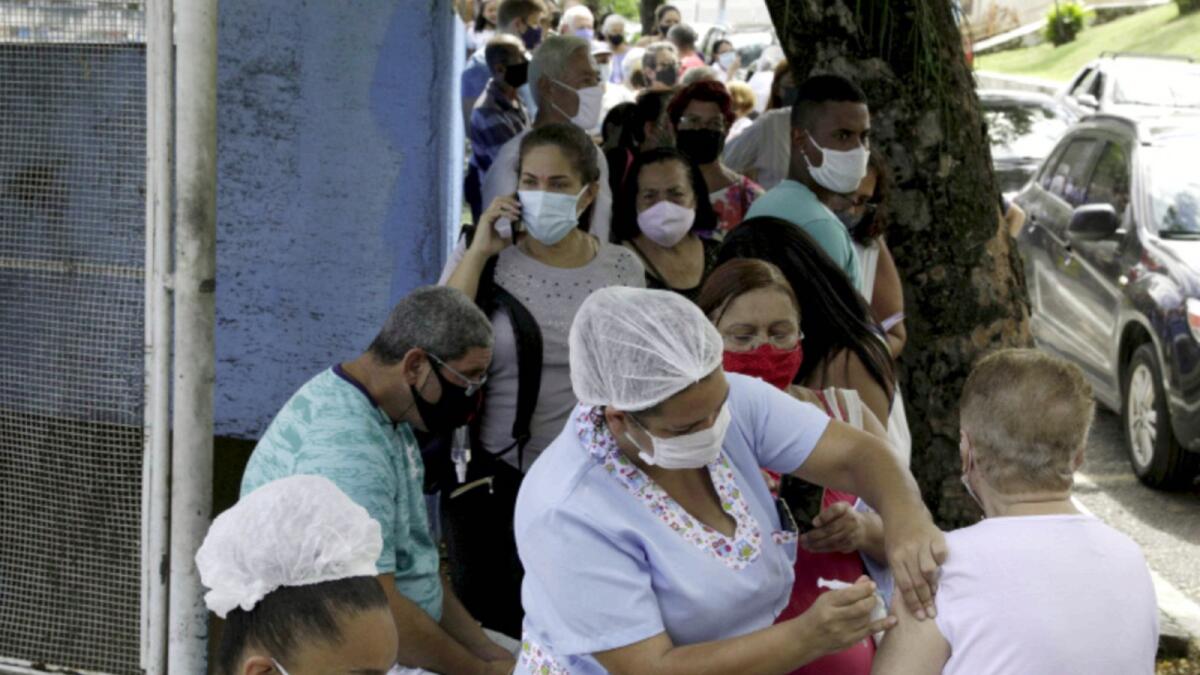 A health worker applies a Sinovac's CoronaVac vaccine on an elderly citzen in Sao Goncalo near Rio de Janeiro, Brazil. — Reuters