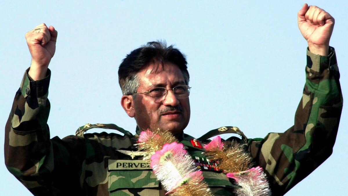 Musharraf is pictured gesturing during a speech