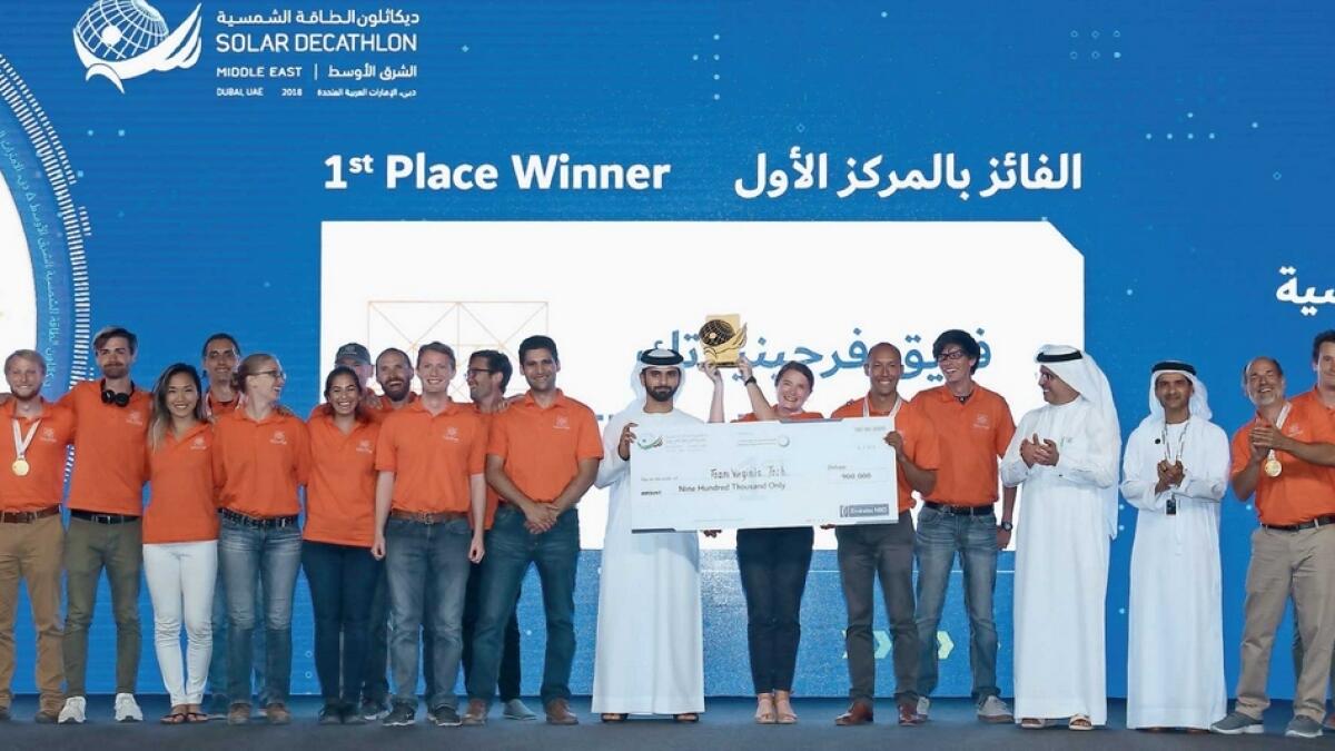 Sheikh Mansoor awards the SDME first-place prize to the Virginia Tech University team  on Wednesday. — Photo by Juidin Bernarrd