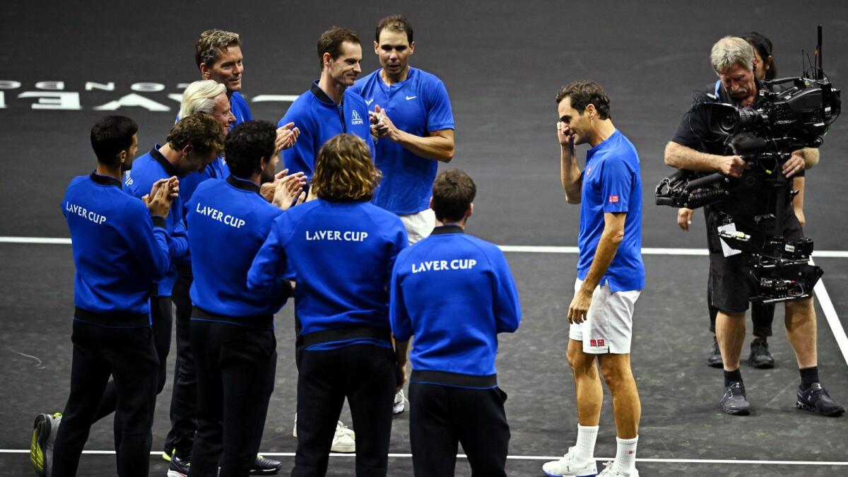 Roger Federer with Team Europe members after his last match. — Reuters