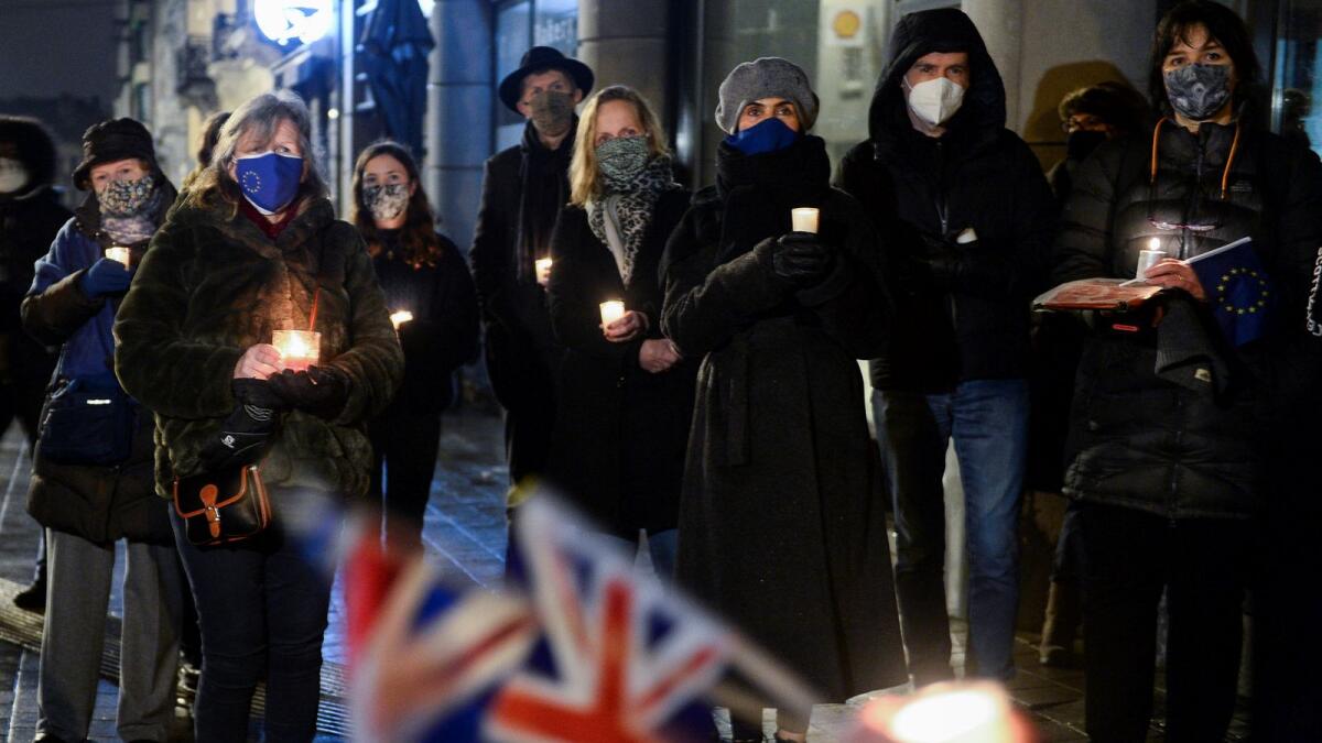 British people living in Brussels who oppose Brexit hold a candlelit vigil outside the British embassy as the transition period comes to an end in Brussels, Belgium December 31, 2020.