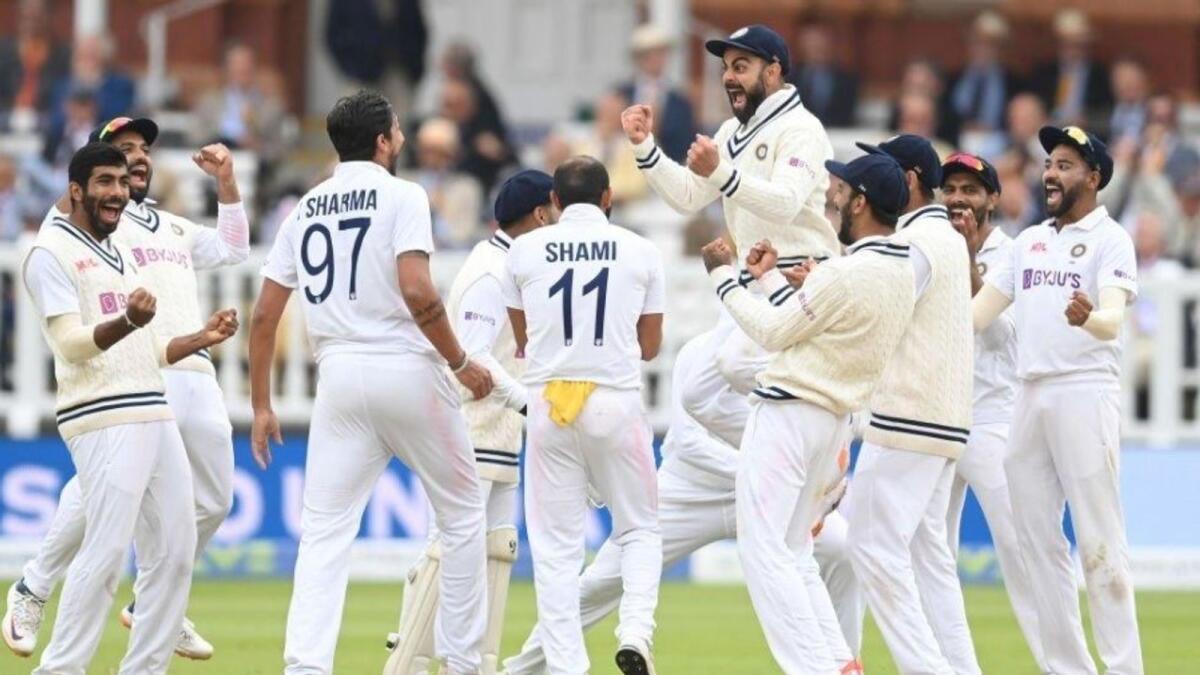 Virat Kohli celebrates a wicket with his teammates. (Twitter)