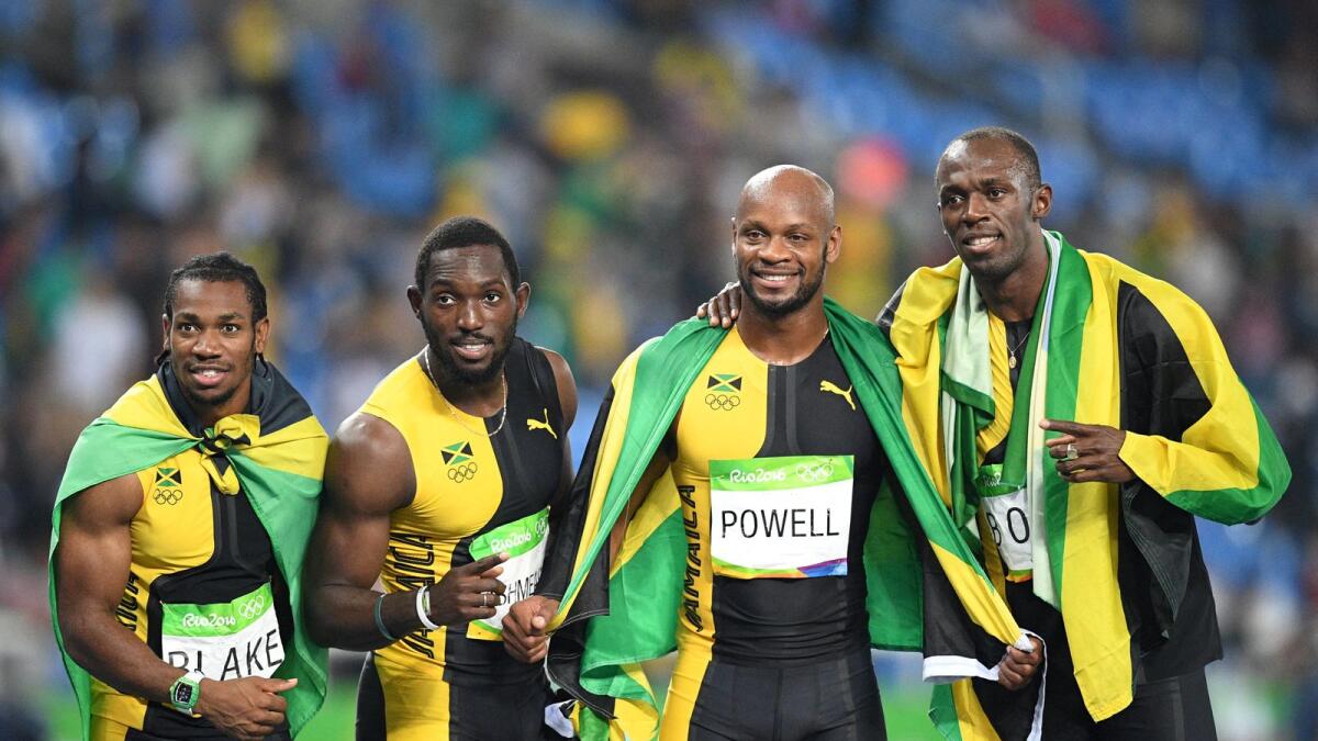 Jamaica's Yohan Blake (left), Nickel Ashmeade, Asafa Powell and Usain Bolt celebrate after winning the 4x100m gold at the Rio 2016 Olympic Games. (AFP)