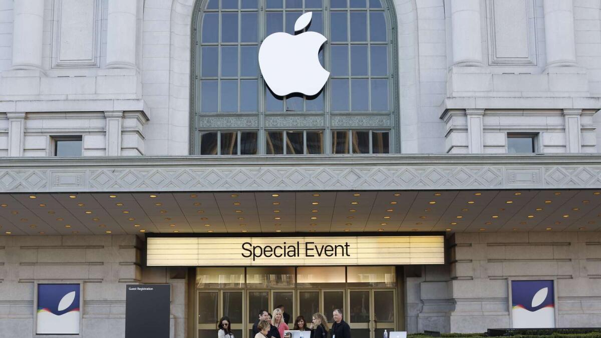SAN FRANCISCO, CA - SEPTEMBER 9: Event staff look at a computer in front of an Apple logo outside Bill Graham Civic Auditorium on September 9, 2015 in San Francisco, California. Apple Inc. is expected to unveil latest iterations of its smart phone, forecasted to be the 6S and 6S Plus. The tech giant is also rumored to be planning to announce an update to its Apple TV set-top box.   Stephen Lam/ Getty Images/AFP== FOR NEWSPAPERS, INTERNET, TELCOS &amp; TELEVISION USE ONLY ==