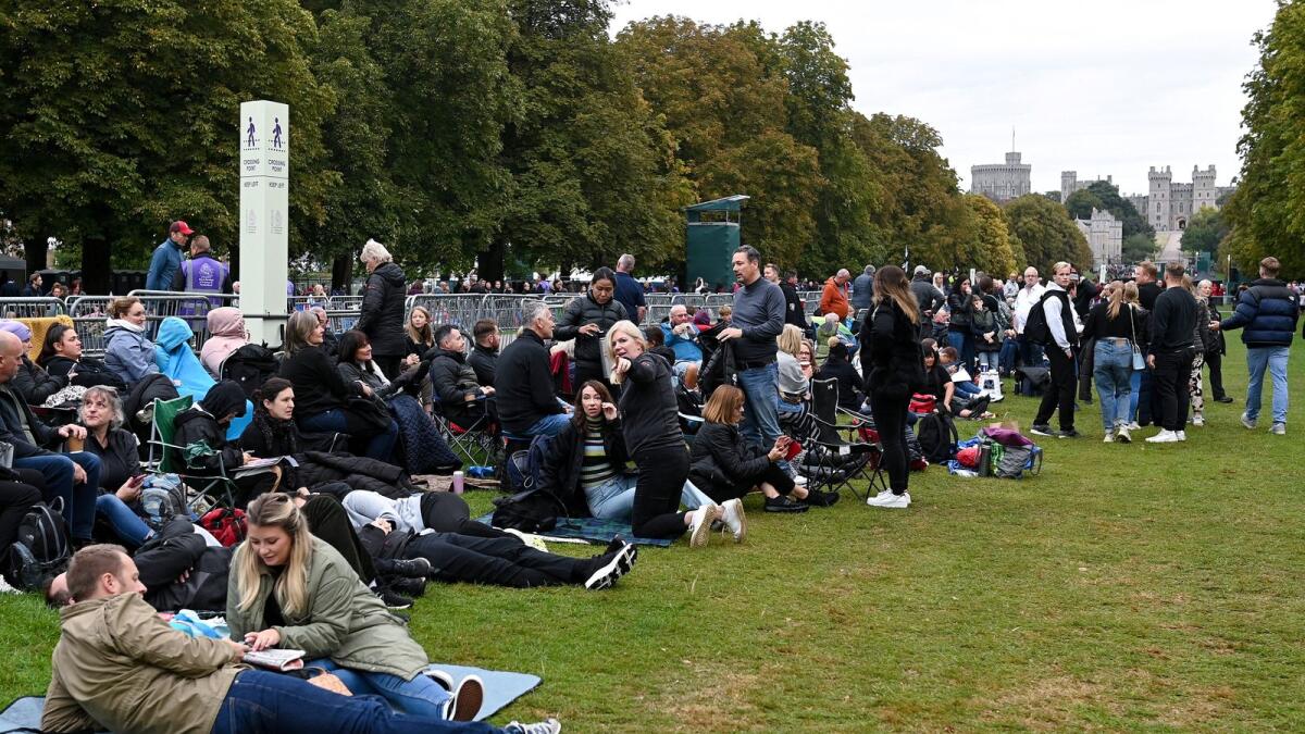 Thousands of mourners camped out ahead of the Queen's state funeral to get a glimpse of the late monarch's funeral procession. – Photos by Reuters