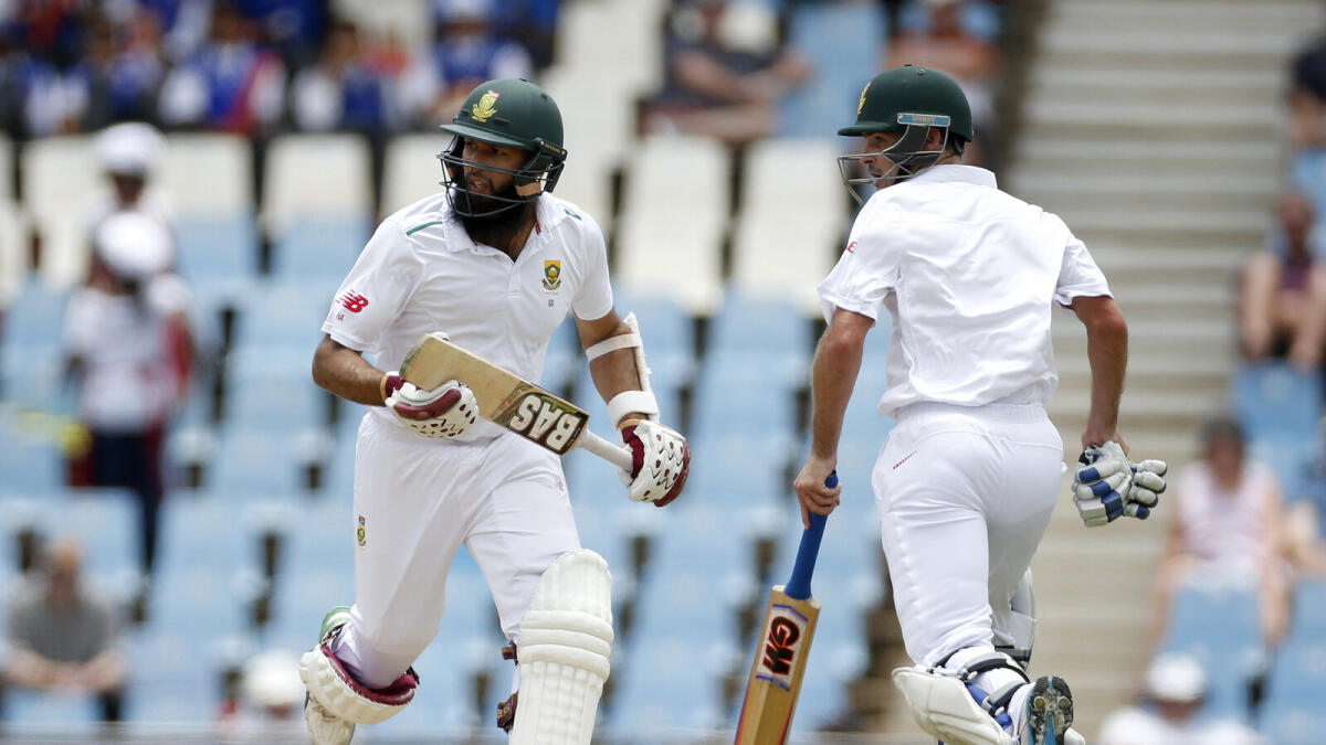 South Africa’s Hashim Amla (left) and Stephen Cook take a run during the first day of the fourth Test against England. 