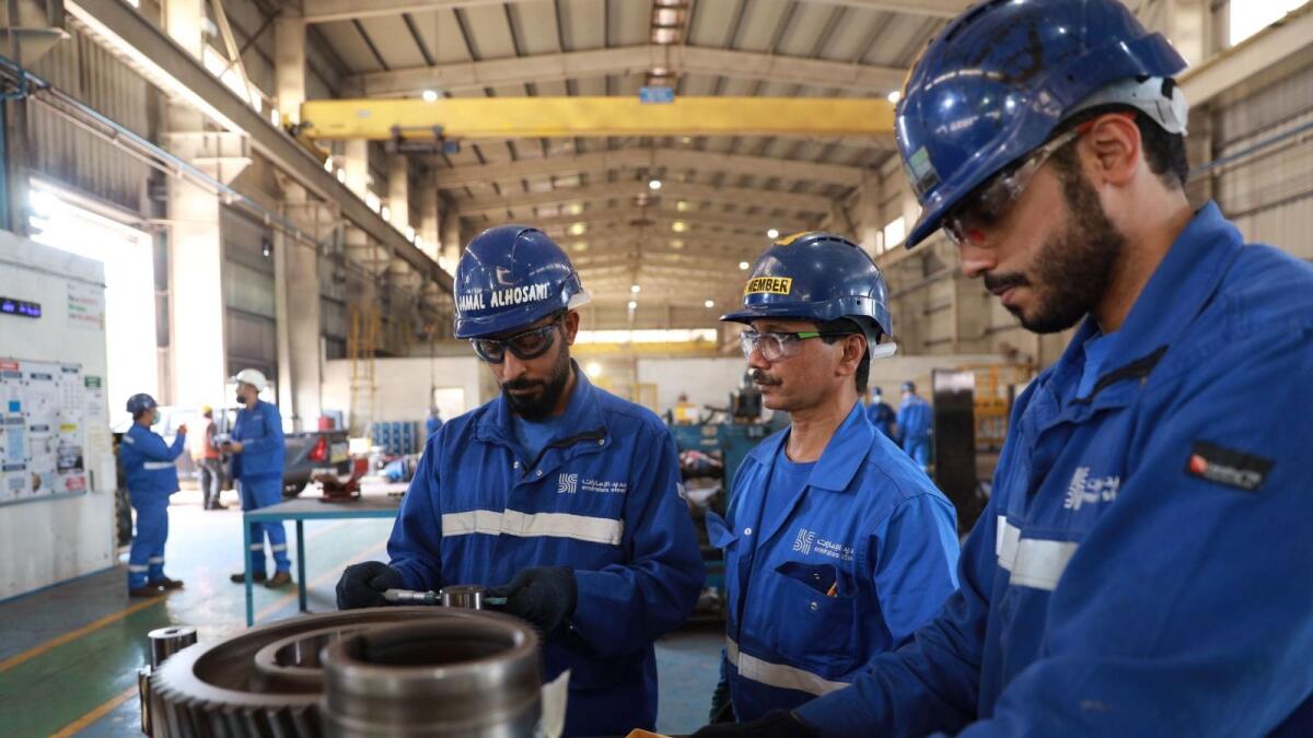Workers at Emirates Steel Arkan. — File photo