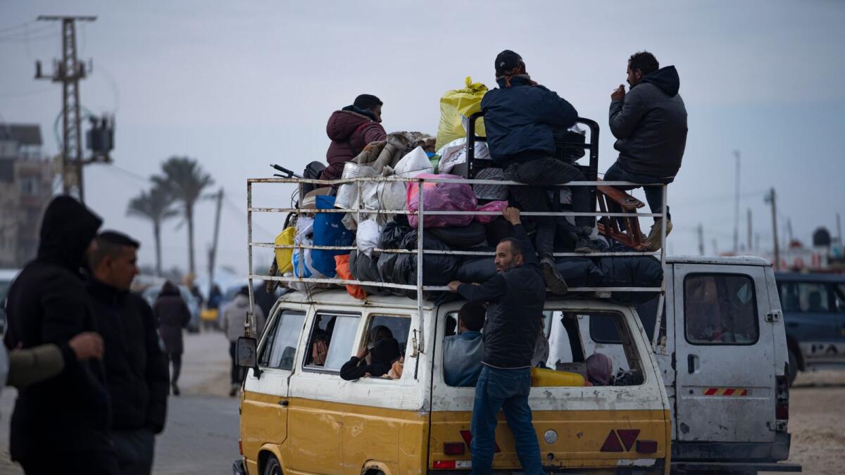 Palestinians arrive in the southern Gaza town of Rafah after fleeing an Israeli ground and air offensive in the nearby city of Khan Younis. — AP