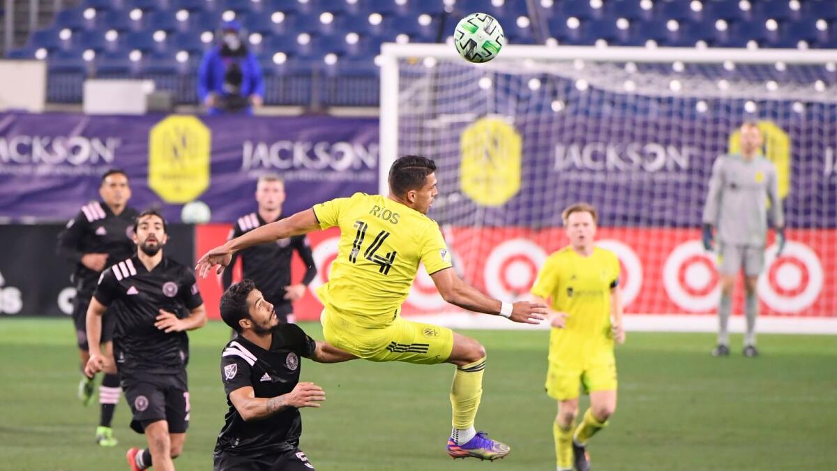 Nashville SC forward Daniel Rios (14) goes for a header during the match against  Inter Miami at Nissan Stadium. — Reuters