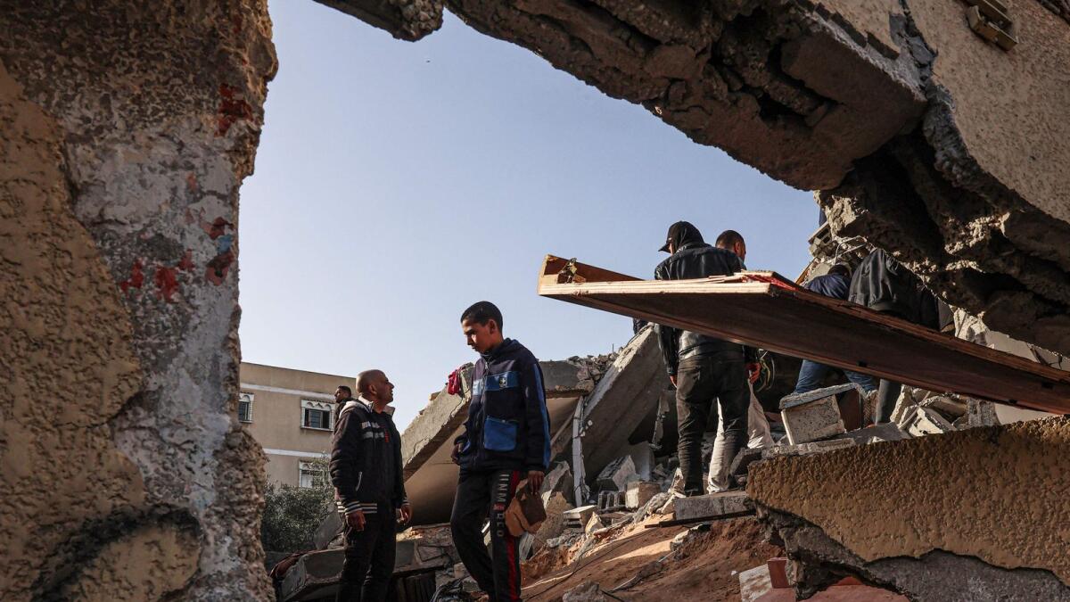 Palestinians check the rubble of a house destroyed in an overnight Israeli air strike in Rafah in the southern Gaza Strip on March 3, 2024. Photo: AFP