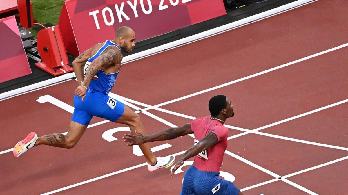 Italy's Lamont Marcell Jacobs (left) won the 100m at the Tokyo Olympics. (AFP)