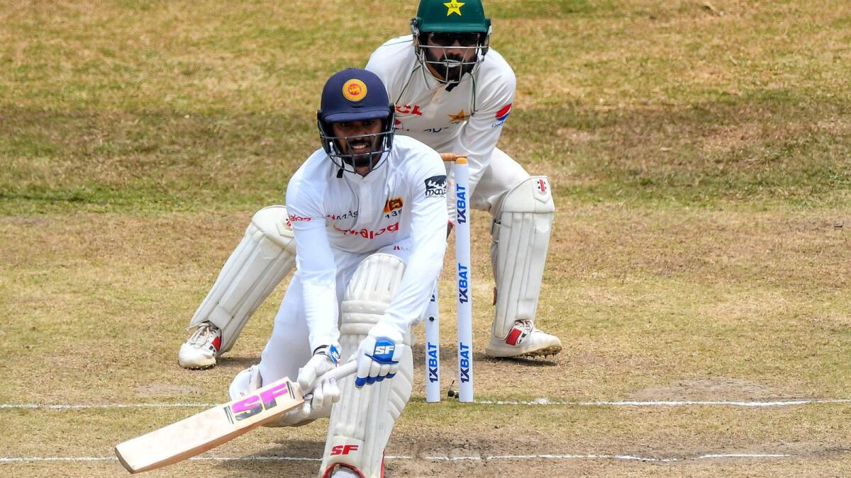 Sri Lanka's Dhananjaya de Silva plays a shot as Pakistan wicketkeeper Mohammad Rizwan looks on during the fourth day of the second Test in Galle on Wednesday. — AFP