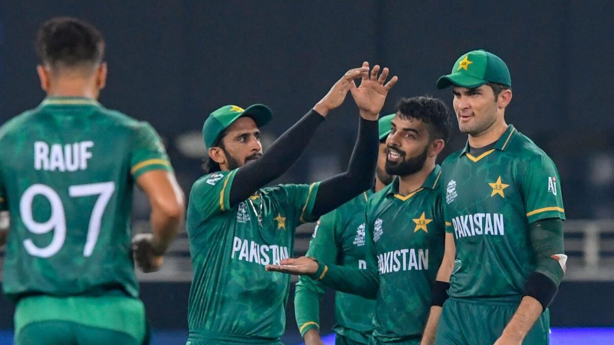 Pakistan's Shadab Khan (second right) celebrates a wicket with teammates. (AFP)