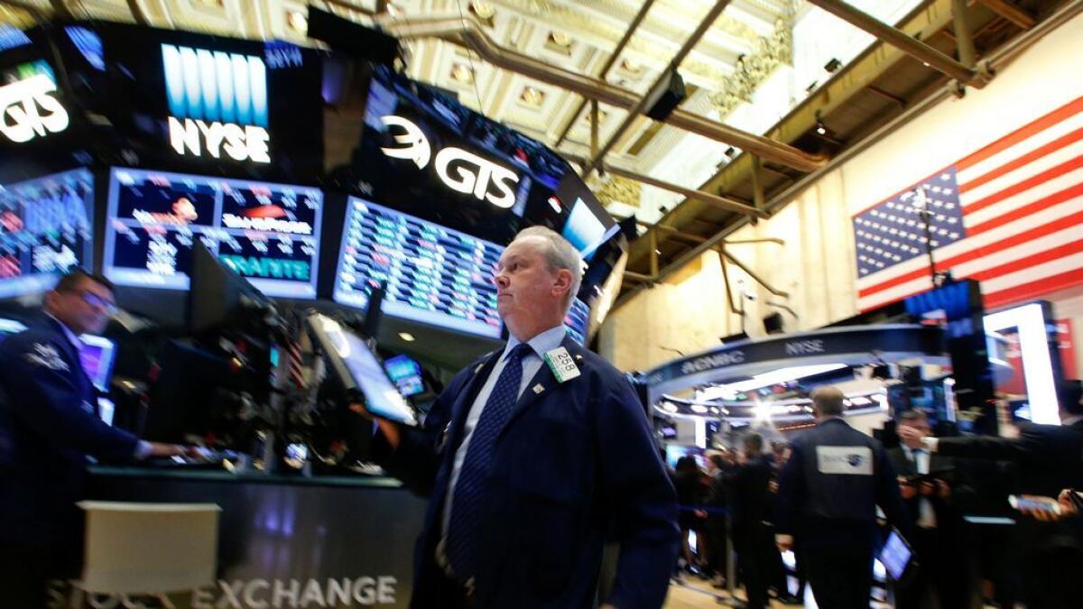 Traders work on the floor of the New York Stock Exchange in New York City, US. Signs of pessimism over the economy have crept into asset prices in recent weeks
