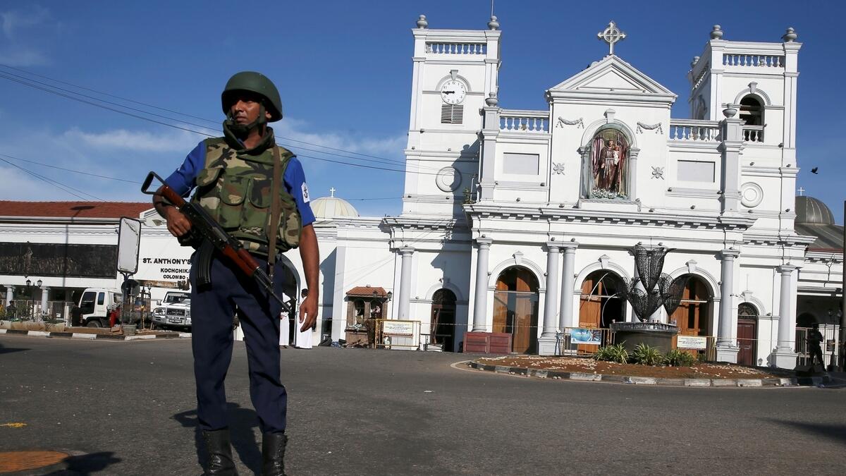 A security officer stands in front of St Anthonys shrine in Colombo, after bomb blasts ripped through churches and luxury hotels on Easter, in Sri Lanka.-Reuters