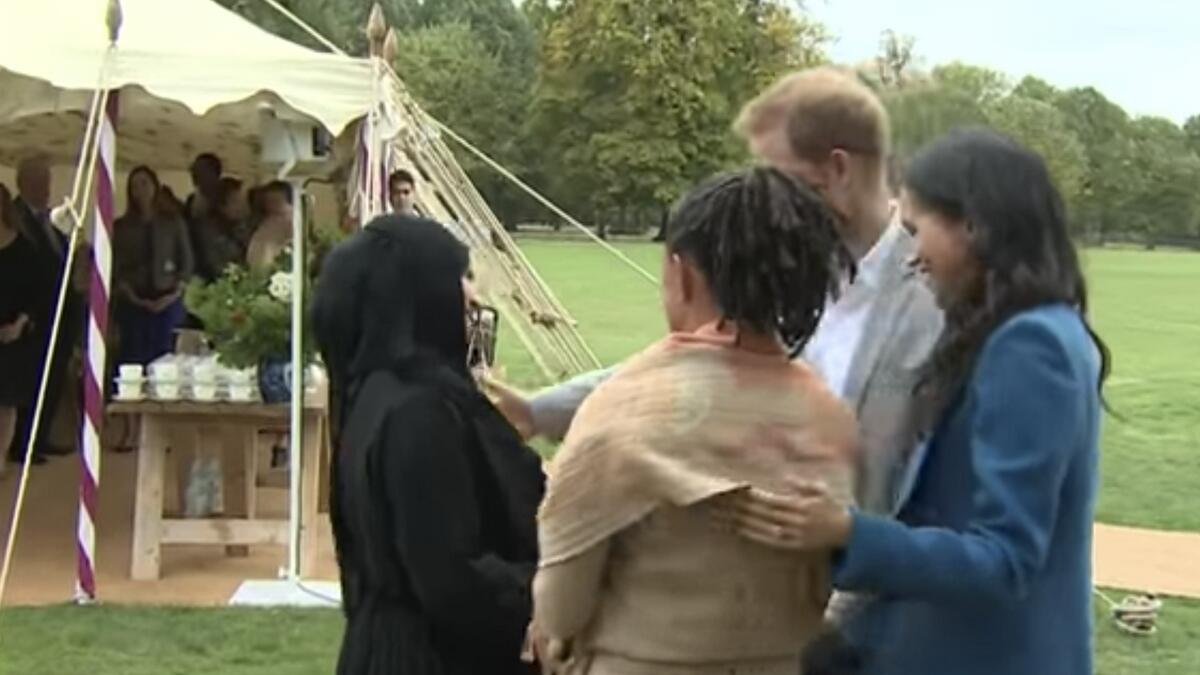 Video: British royal gives Muslim woman awkward kiss at charity event
