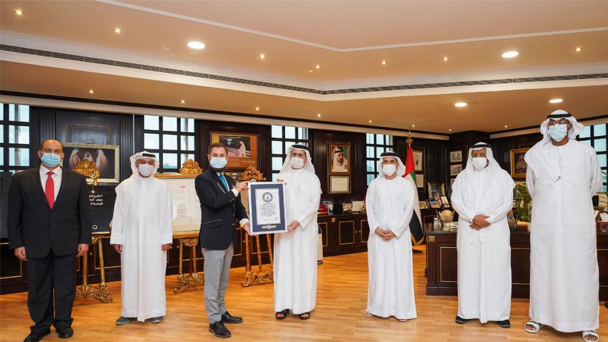 Saeed Mohammed Al Tayer with other delegates receiving the Guinness World Records certificate for the largest single-site natural gas power generation facility in the world. — Supplied photo