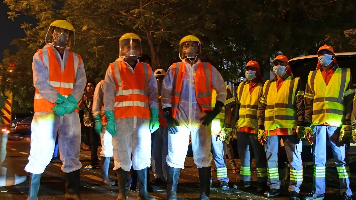 Wearing jumpsuits and protective gears, scores of Dubai municipality workers took to the  streets of Dubai