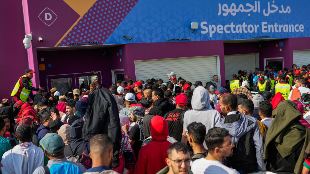 Fans queue outside of the Al Janoub Stadium in Wakrah, Qatar, in the hope of getting tickets for Wednesday's World Cup semi-final match between France and Morocco. — AP
