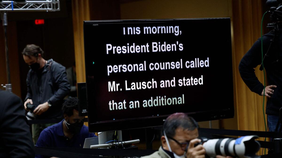 A television displays US Attorney General Merrick Garland's remarks during a news conference at the Justice Department to announce the appointment of a Special Counsel to investigate the discovery of classified documents held by President Joe Biden at an office and his home on Thursday in Washington, DC. — AFP