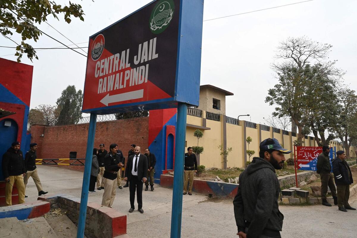 Police personnel stand outside the entrance of Adiala jail during the hearing of jailed former Pakistan's Prime Minister Imran Khan in Rawalpindi on January 30, 2024. — AFP