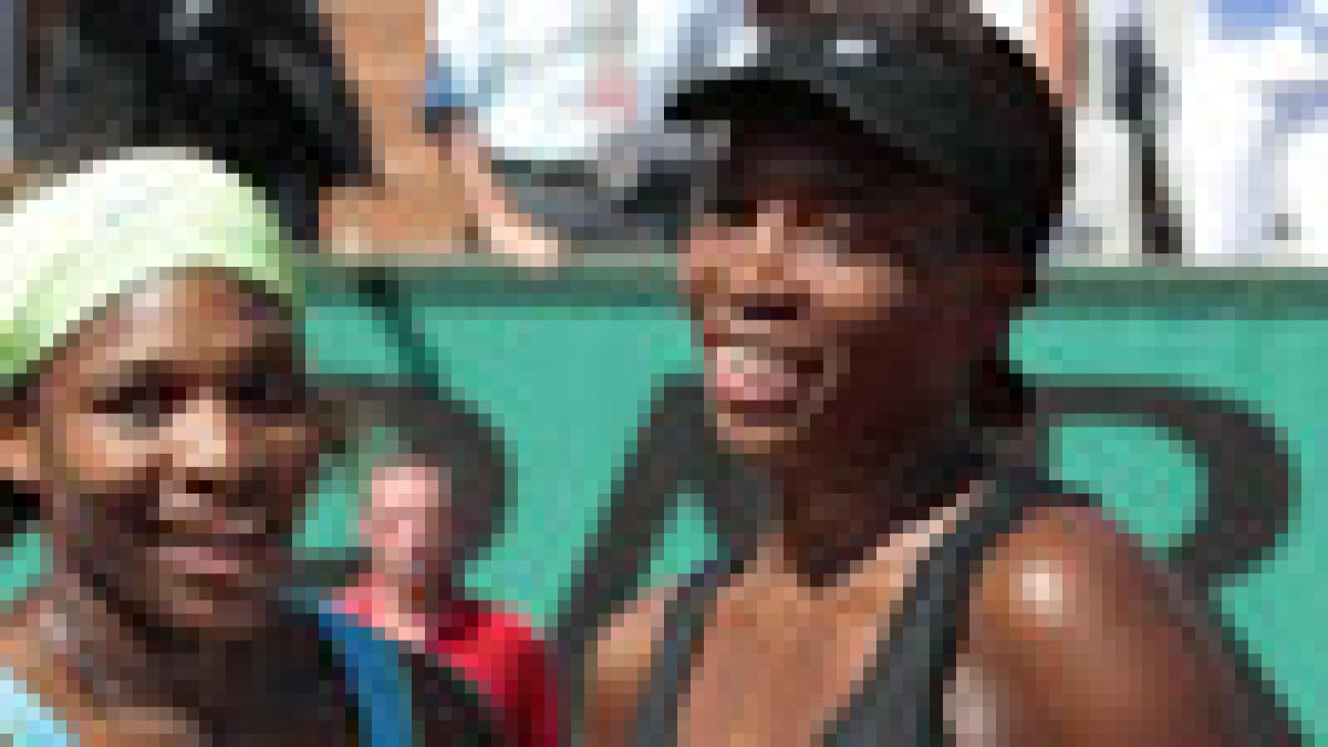 Williams sisters win French Open doubles