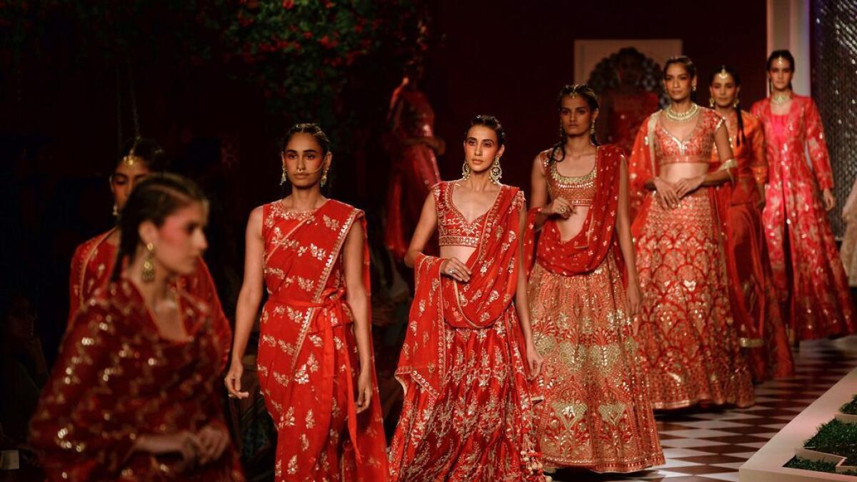 Models present creations by Indian fashion designer Anita Dongre during the FDCI India Couture week 2016 in New Delhi 