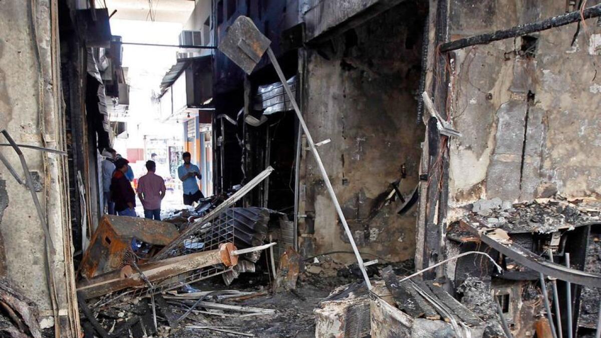 Shops gutted in an early morning fire in al Ghuwair Market in Sharjah on Saturday.