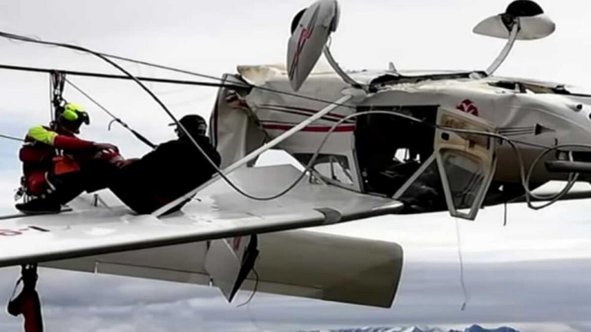 Plane, upside-down, crash, pilot, Italian Alps, dramatic pictures, mountain rescue