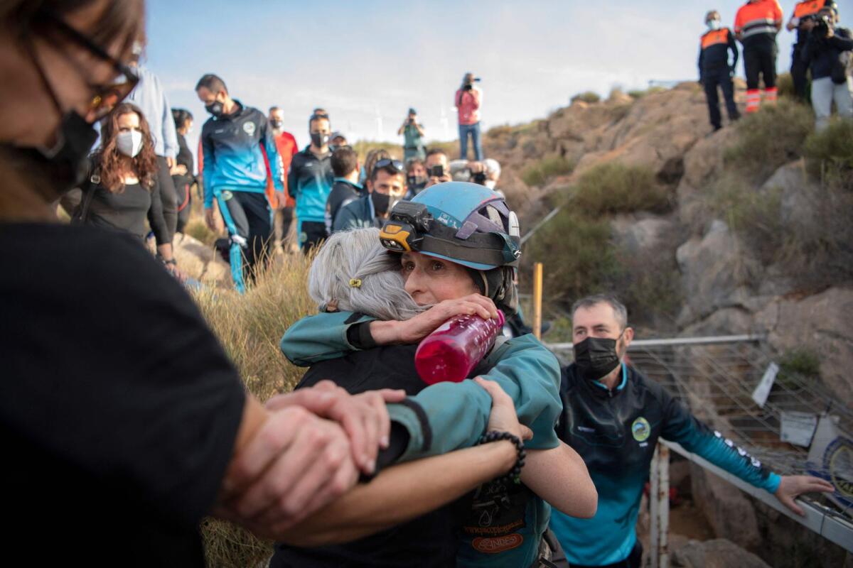 Spanish sportswoman Beatriz Flamini (R) hugs a relative upon getting out of a cave in Los Gauchos, near Motril, on Friday after spending 500 days inside. — AFP