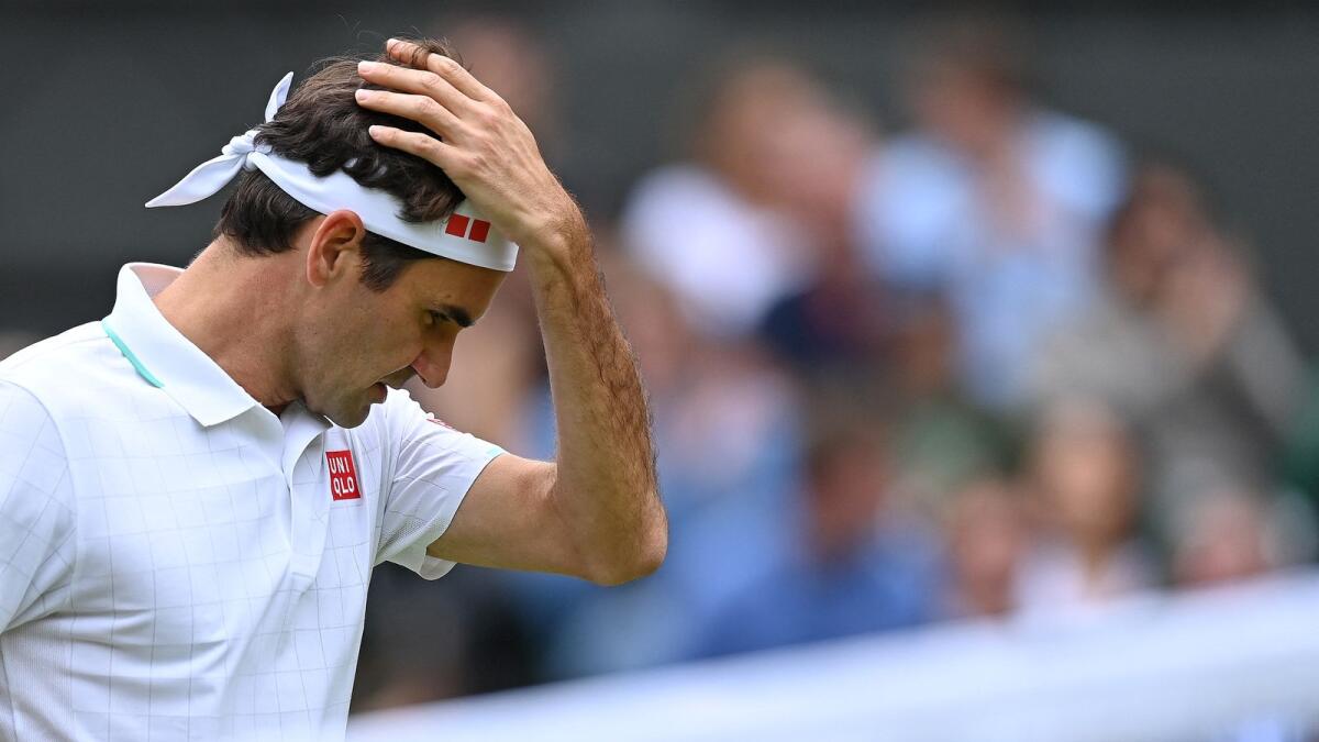 Roger Federer reacts during his match against Hubert Hurkacz. (AFP)