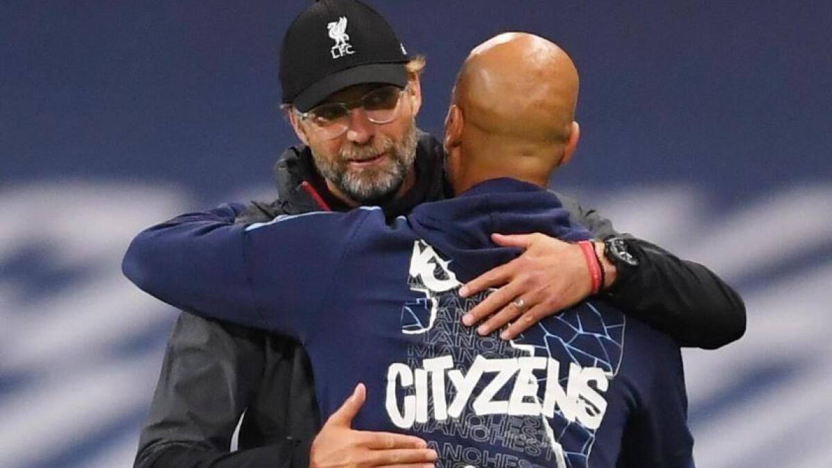 Liverpool manager Jurgen Klopp with Manchester City manager Pep Guardiola after the match (Reuters)
