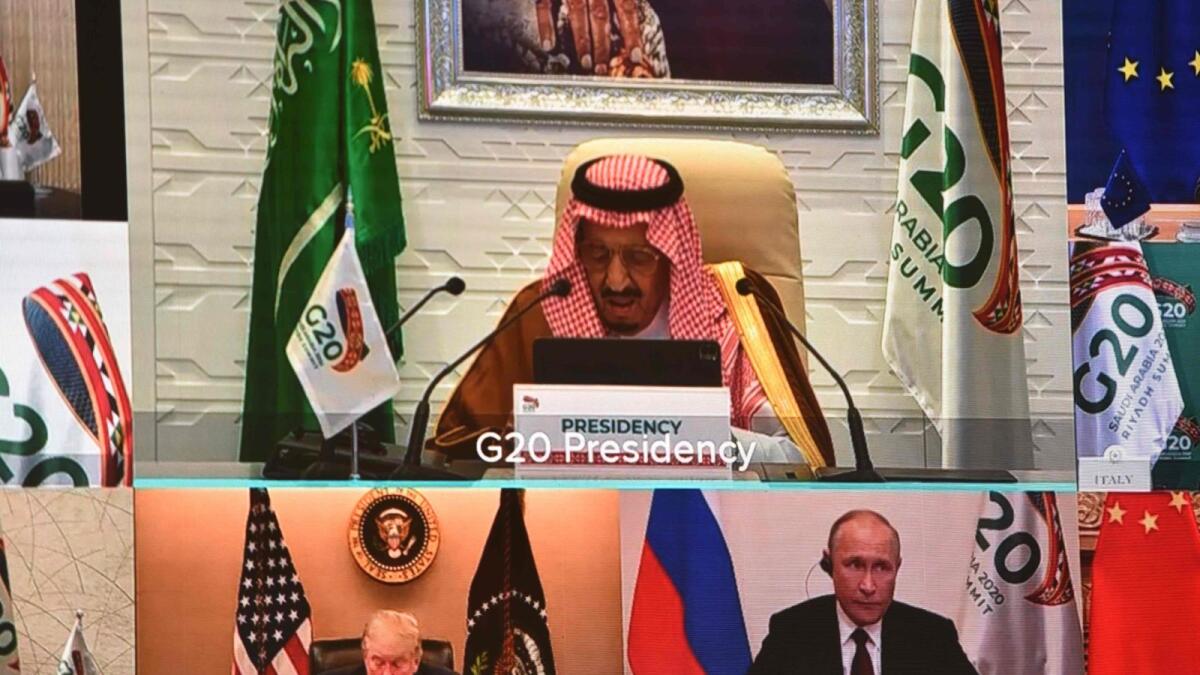 Saudi King Salman bin Abdulaziz giving his opening remarks as US President Donald Trump and Russian President Vladimir Putin are projected on a screen at the International Media Centre in Riyadh on Saturday.