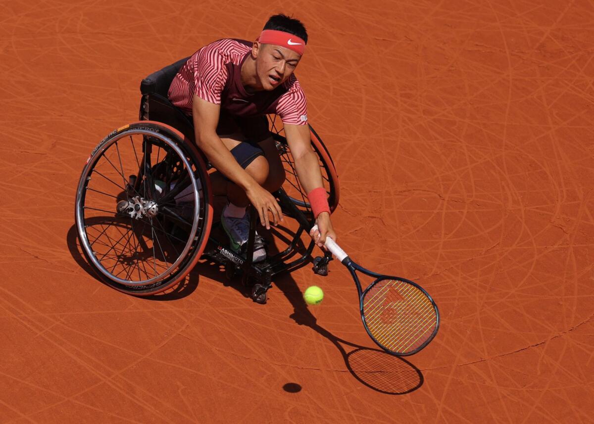 Japan's Tokito Oda plays a forehand return to Britain's Alfie Hewett during the men's wheelchair singles final at Roland-Garros. - AFP