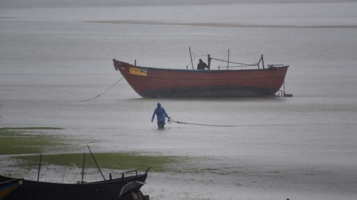 Fishermen tie their boats along the shore before Cyclone Amphan makes its landfall, in the Baleswar district of the eastern state of Odisha, India, May 20. REUTERS/Stringer