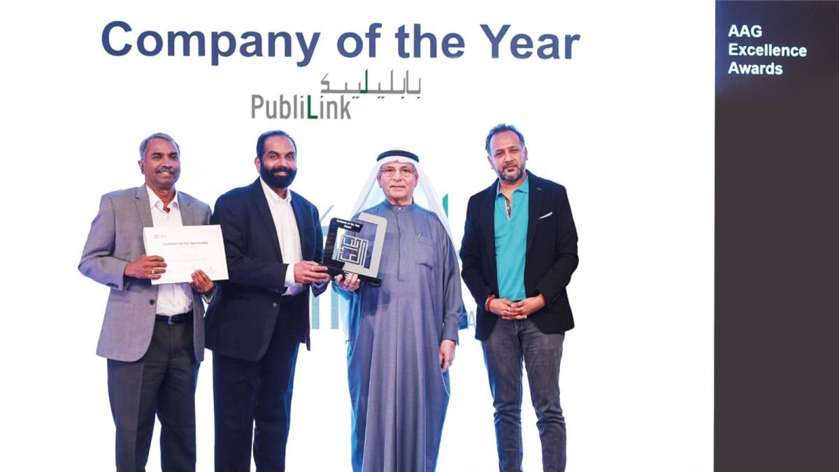 Ebrahim Ahmed Al Abbas, chairman, Al Abbas Group, handing over the ‘Company of the Year Award’ to Reghu Menon, managing director, Publilink, in the presence of Dheeraj Thakur and Sunil Roy. — Supplied photo