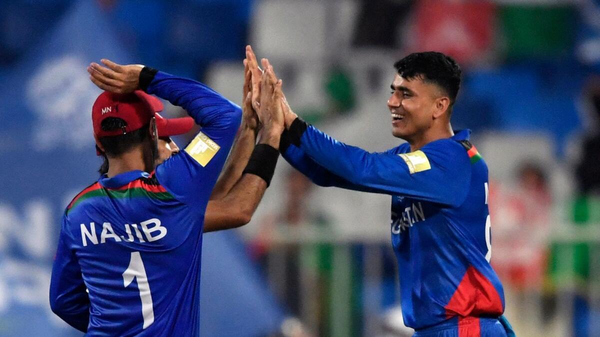 Afghanistan's Mujeeb Ur Rahman celebrates after taking the wicket of Scotland's Richie Berrington. (ANI)