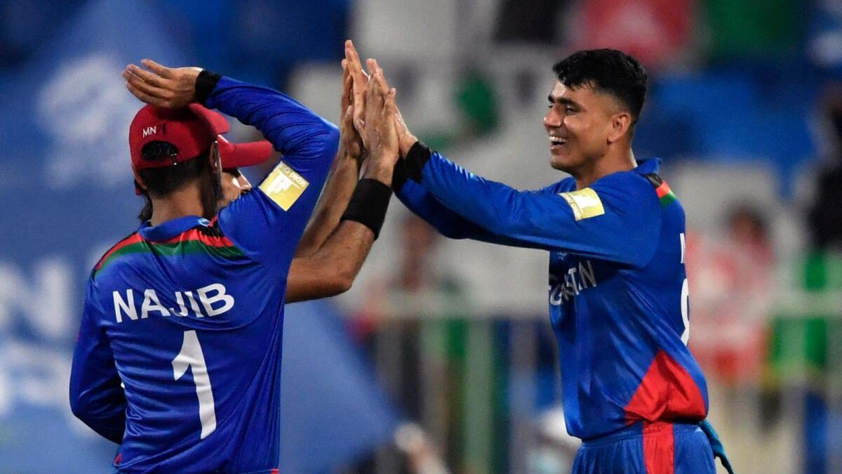 Afghanistan's Mujeeb Ur Rahman celebrates after taking the wicket of Scotland's Richie Berrington. (ANI)