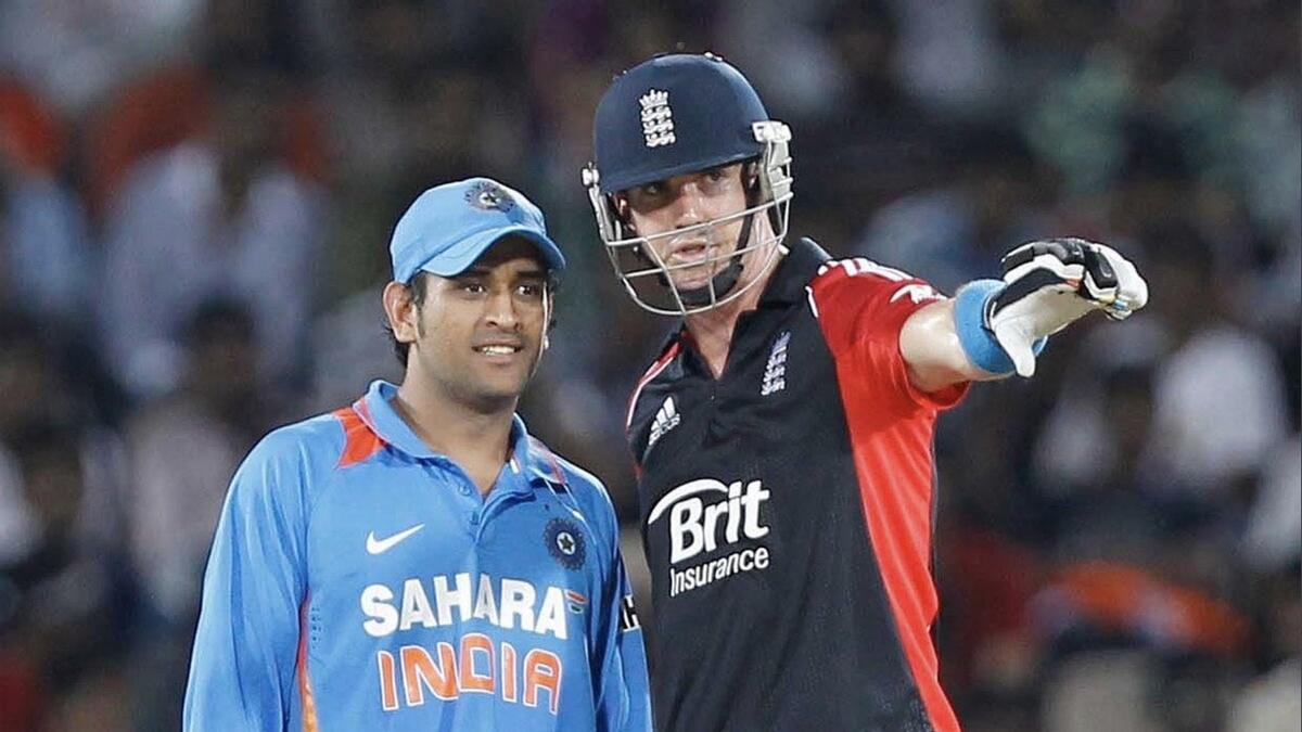 Former India captain MS Dhoni (left) with former England skipper Kevin Pietersen. - Twitter