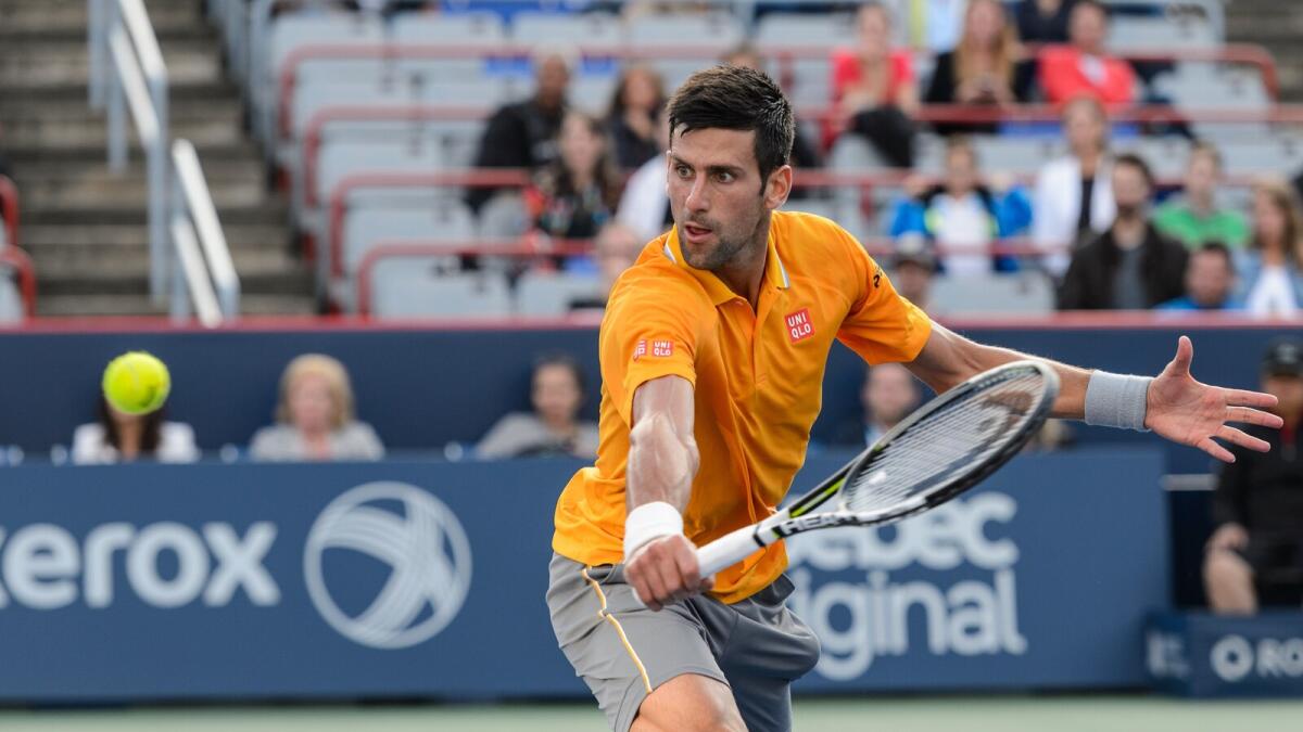 Novak Djokovic of Serbia returns the ball during day two of the Rogers Cup against Thomaz Bellucci of Brazil. 