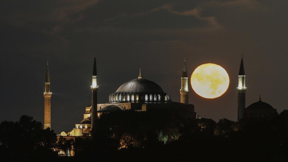 The full moon rises behind the Byzantine-era Hagia Sophia, in the historic Sultanahmet district of Istanbul, Turkey. Photo: AP